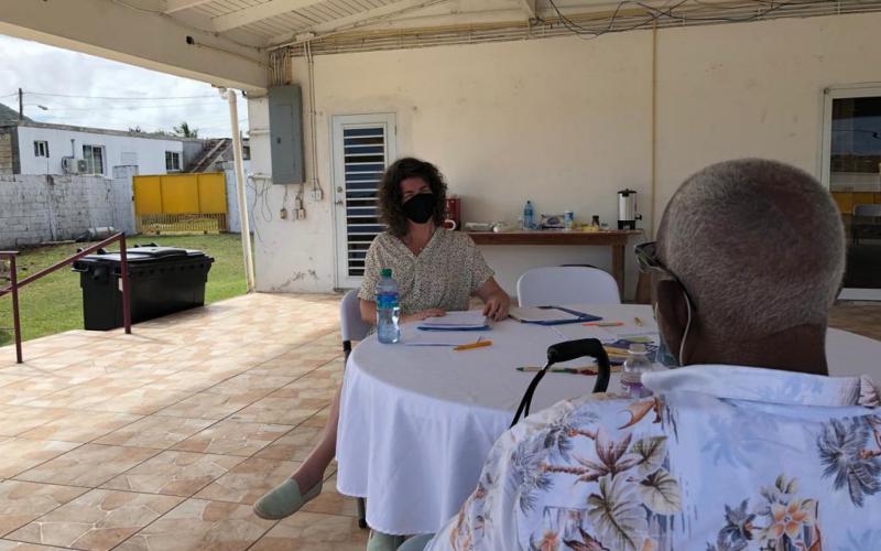 Two people talking at the walk-in sessions at the Dutch Caribbean