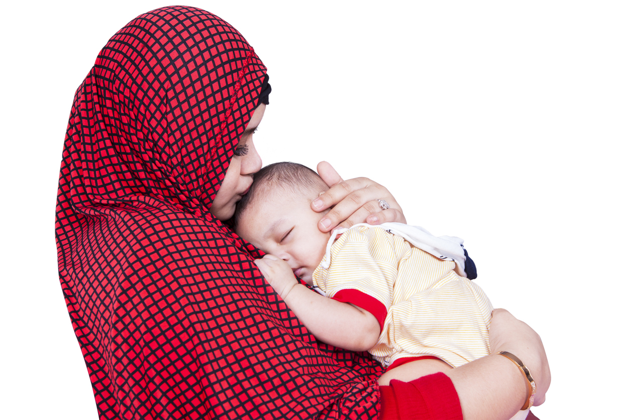 Moslim vrouw met baby Moslim vrouw met baby