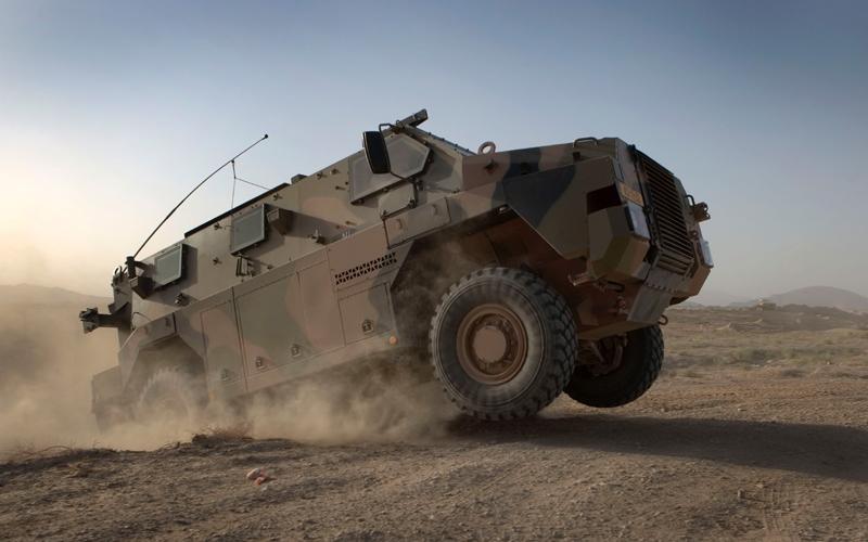 Foto van een bushmaster, militair voertuig Foto van een bushmaster, militair voertuig