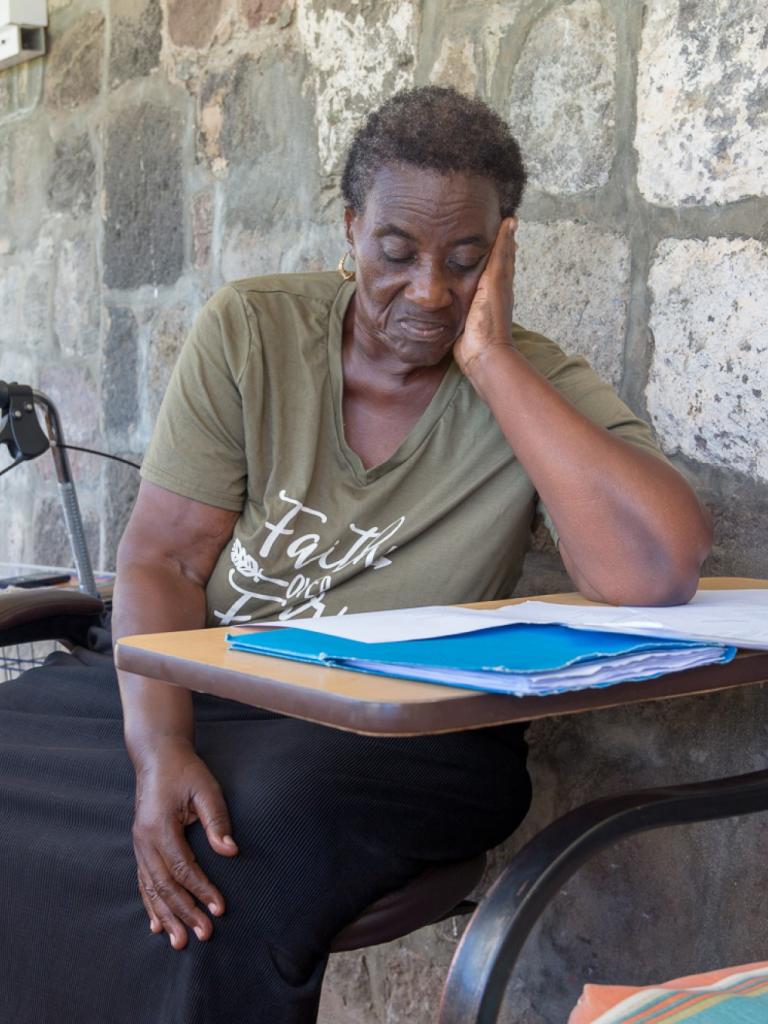 Caribbean woman looking at documents