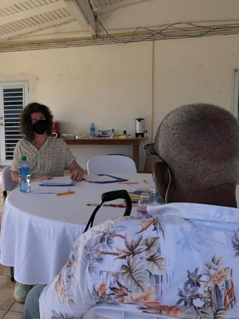 Two people talking at the walk-in sessions at the Dutch Caribbean